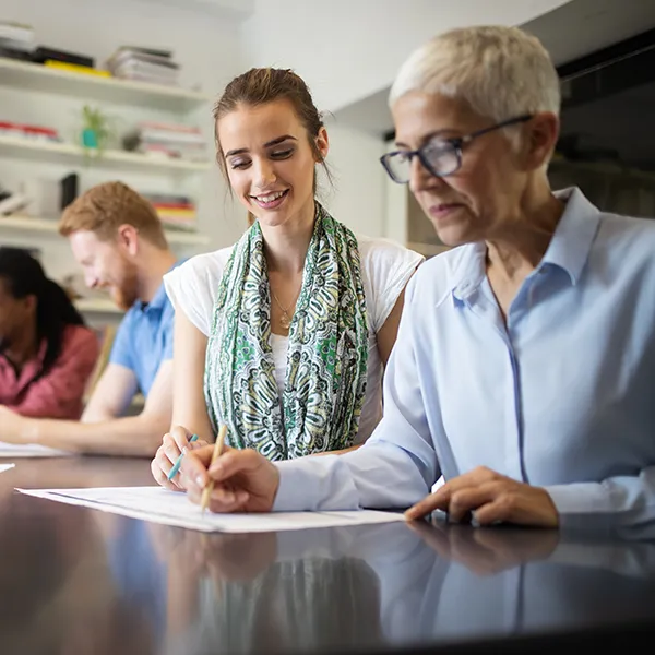Group of students collaborating on project in office